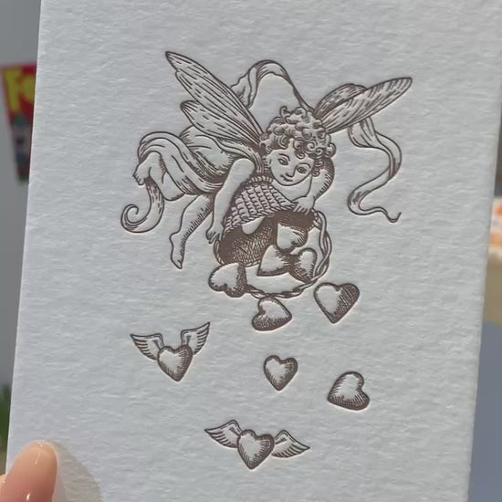 A video of the cherub and heart card